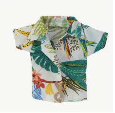 Mini colorful tropical shirt with floral and leaf patterns on a white background