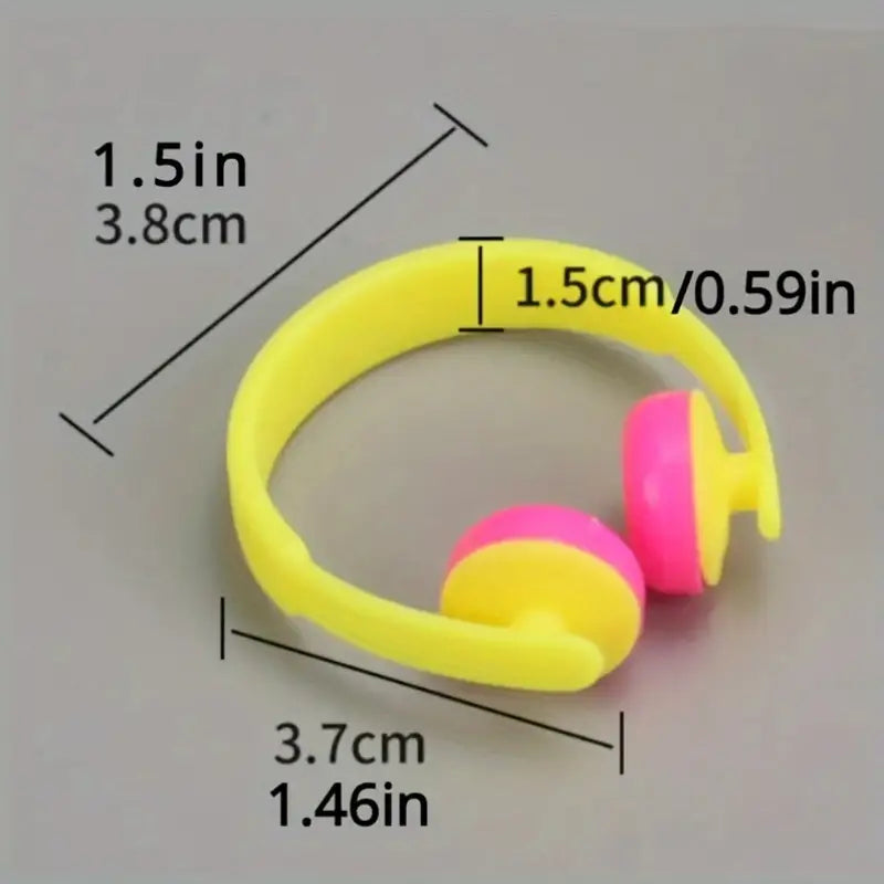 Yellow and pink mini headphones with measurements on a gray background