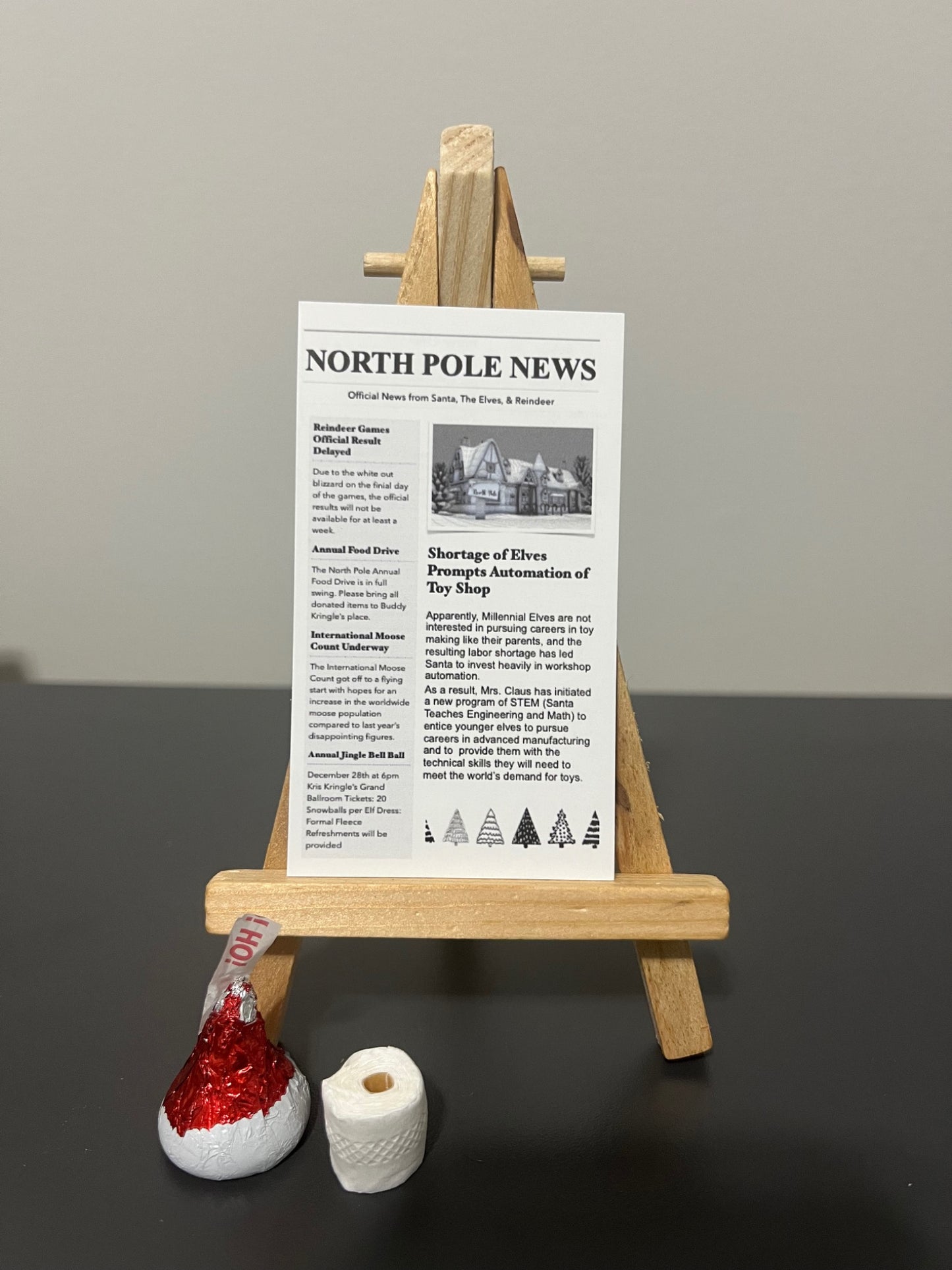 Elf Bathroom Prank Set with mini newspaper, toilet paper, and chocolate kiss