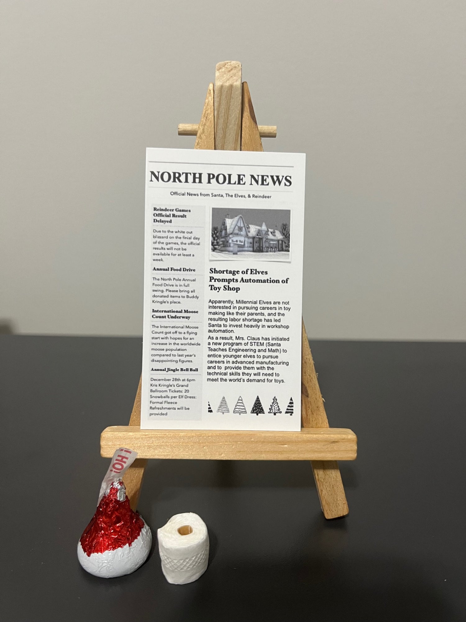 Elf Bathroom Prank Set with mini newspaper, toilet paper, and chocolate kiss
